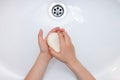 Washing child`s hands with antibacterial soap over the white sink. Protection against bacteria, coronavirus Royalty Free Stock Photo