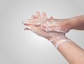 Washing or cleaning hands with soap.