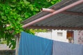 Washing cloths and green tree in out side of house Royalty Free Stock Photo