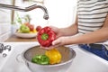 Washing colorful peppers