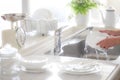 Washing dishes, bright kitchen image, Royalty Free Stock Photo