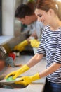 Washing dishes, cleaning and woman in kitchen with foam for remove dirt, sponge and bacteria protection. Plate, sink and Royalty Free Stock Photo