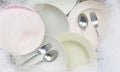 Washing dishes, Close up of utensils soaking in kitchen sink