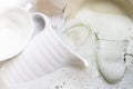 Washing dishes, Utensils soaking in kitchen sink Royalty Free Stock Photo