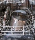 Washing dishes in the dishwasher with water drops and foam Royalty Free Stock Photo