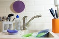 Washing dishes in the kitchen. Dirty dishes plates and glasses lie in the sink. front view. homework Royalty Free Stock Photo