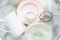 Washing dishes, utensils soaking in kitchen sink Royalty Free Stock Photo