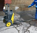 Washing of a facade. Pressure vessel. Royalty Free Stock Photo