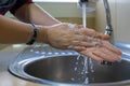 Washing female hands properly. Hygiene concept. Rubbing with soap and water Royalty Free Stock Photo