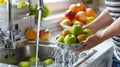 Washing fresh apples under faucet water in kitchen. Clean and healthy fruits. Bright and fresh colors. Perfect for food