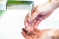 Washing hand under tap water