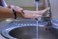 Washing hands and arms properly. Rubbing with soap and water. Hygiene concept Royalty Free Stock Photo