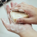 Washing hands with a bar soap to prevent coronavirus contamination Royalty Free Stock Photo