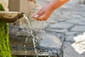 Washing hands in fresh, cold, potable source water on a mountain, Drinking Spring, Wooden Pipe of Fresh Potable, Unpolluted, Royalty Free Stock Photo