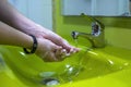 Washing hands properly. Hygiene concept. Rubbing with soap and water. Colorful sink Royalty Free Stock Photo