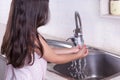 Washing hands. Side view brunette girl washing her hands