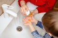 Washing hands with soap under the faucet with water. Clean and Hygiene Royalty Free Stock Photo