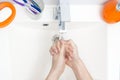 Washing of hands with soap under running water in white sink. close - up. antivirus protection wash your hands. Royalty Free Stock Photo