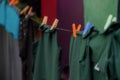 Washing line with clean dark clothes drying eco-friendly outdoors hanging Royalty Free Stock Photo