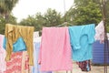 Washing line with drying clothes in outdoor. Clothes hanging on washing Royalty Free Stock Photo