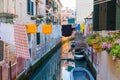 Washing line with laundry clothing air drying over the channel on sunny day. Venice lifestyle Royalty Free Stock Photo