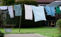 Washing line with towels drying in the garden Royalty Free Stock Photo