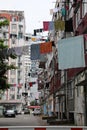 Washing lines with clean clothes hanging on city street Royalty Free Stock Photo