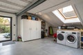 Washing machine with cabinet in attic garage Royalty Free Stock Photo