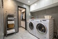Washing machine in a modern gray laundry room Royalty Free Stock Photo