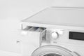 Washing machine with open detergent drawer on white background, closeup Royalty Free Stock Photo