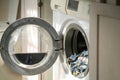 Washing machine with open door at home. Royalty Free Stock Photo