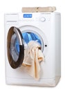 The washing machine with an open door and towels Royalty Free Stock Photo