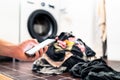 Washing machine, phone and laundry. Smart home technology and smartphone. Person using cellphone or texting. Royalty Free Stock Photo