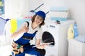 Washing machine repair technician. Washer service Royalty Free Stock Photo