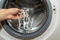 Washing in a washing machine white shoelaces from sneakers Royalty Free Stock Photo
