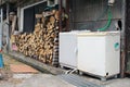 Washing machine and wood logs at Japanese traditional house in Beppu Royalty Free Stock Photo