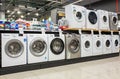 Washing machines displayed in the showroom of a commercial store. Minsk, Belarus - February, 2022 Royalty Free Stock Photo