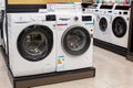 Washing machines displayed in the showroom of a commercial store. Minsk, Belarus - February, 2022 Royalty Free Stock Photo