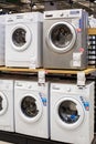 Washing machines displayed in the showroom of a commercial store. Minsk, Belarus - February, 2022 Royalty Free Stock Photo
