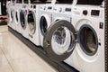 Washing machines displayed in the showroom of a commercial store. Minsk, Belarus - February, 2022 Royalty Free Stock Photo