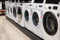 Washing machines displayed in the showroom of a commercial store. Minsk, Belarus - February, 2022 Royalty Free Stock Photo