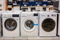 Washing machines displayed in the showroom of a commercial store. Minsk, Belarus - February, 2022 Royalty Free Stock Photo