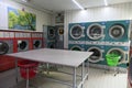 Washing machines and dryers in a self-service laundromat
