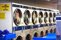 Washing machines inside laundry shop or launderette Royalty Free Stock Photo