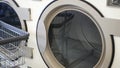 Washing machines, public coin laundry, USA. Self-service laundromat, laundrette.