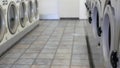 Washing machines, public coin laundry, USA. Self-service laundromat, laundrette.