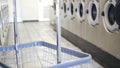 Washing machines, public coin laundry, USA. Self-service laundromat, laundrette.