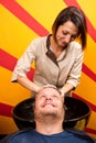 Washing man hair in beauty parlour hairdressing salon Royalty Free Stock Photo