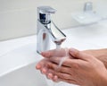 Washing man's hand and turn off faucet out door