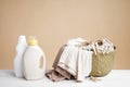 Washing Mockup Beige Background. A Basket Of Colored Laundry, A Clothesline For Drying, Clothespins, A Bottle Of Liquid Detergent